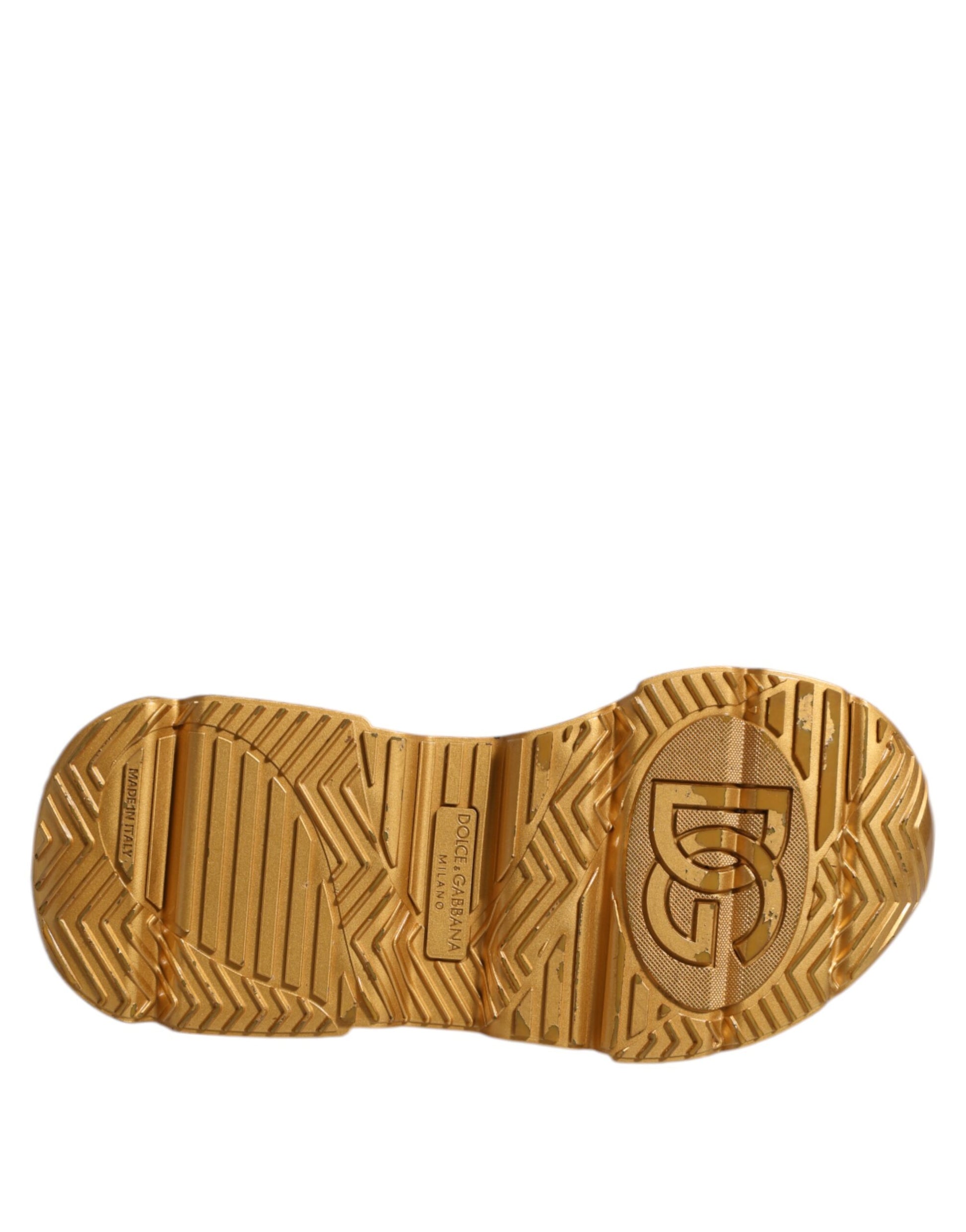 A pair of gold and white sneakers with a logo on the side