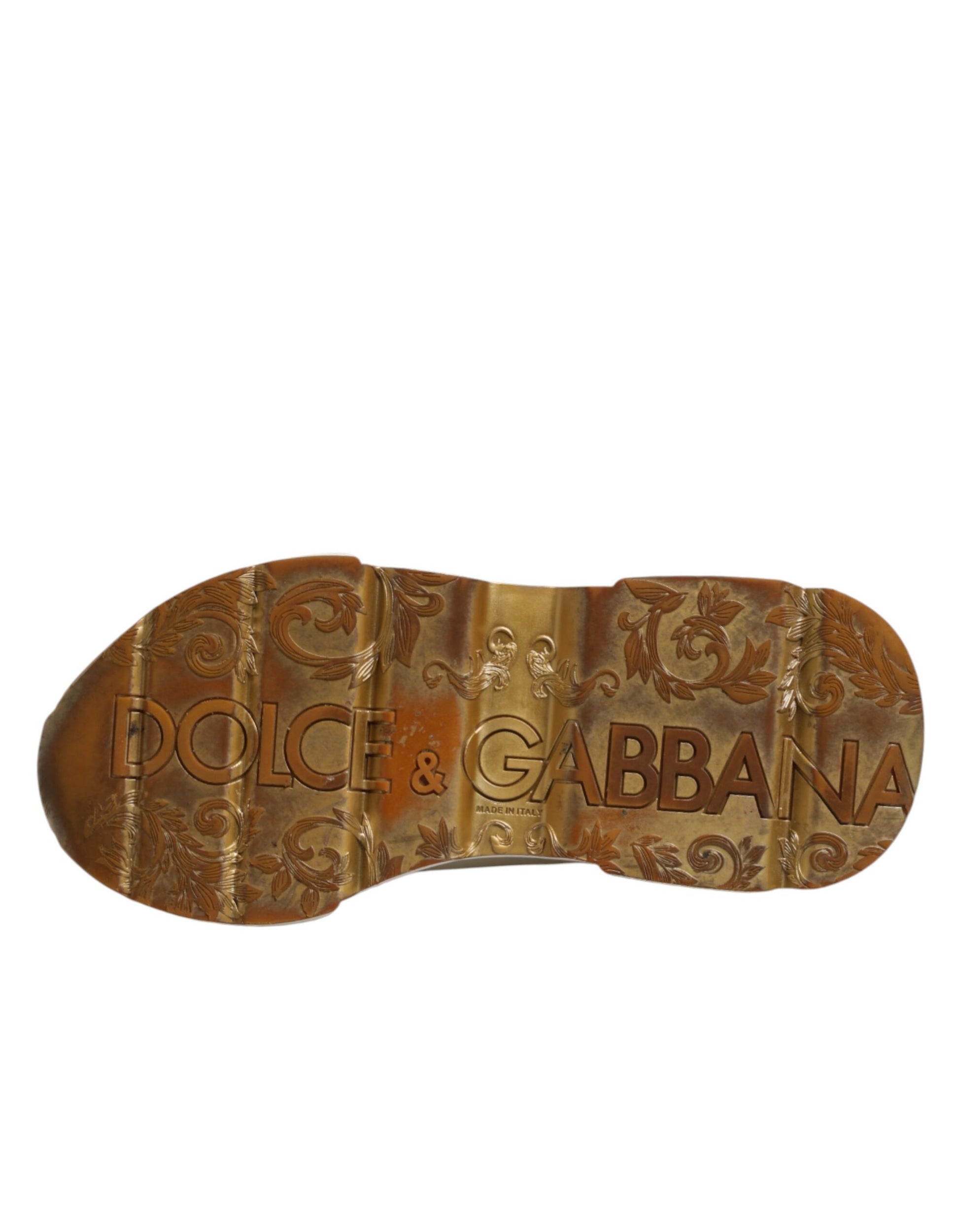 A pair of white gold sneakers with a low top, featuring the brand name "Dolce & Gabbana" on the side