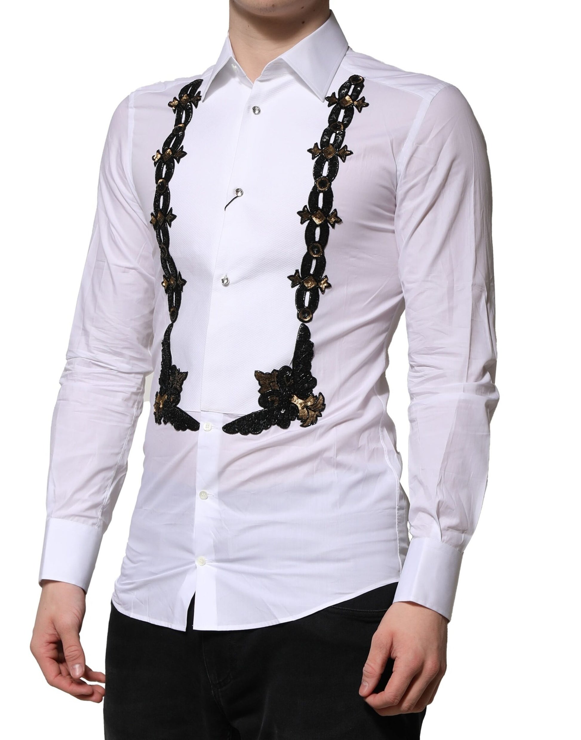 A white dress shirt with gold embellishments on the chest and sleeves