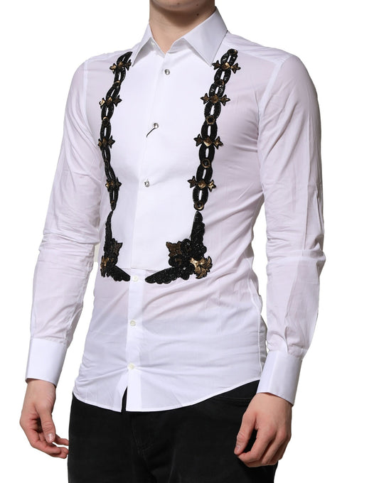 A white dress shirt with gold embellishments on the chest and sleeves