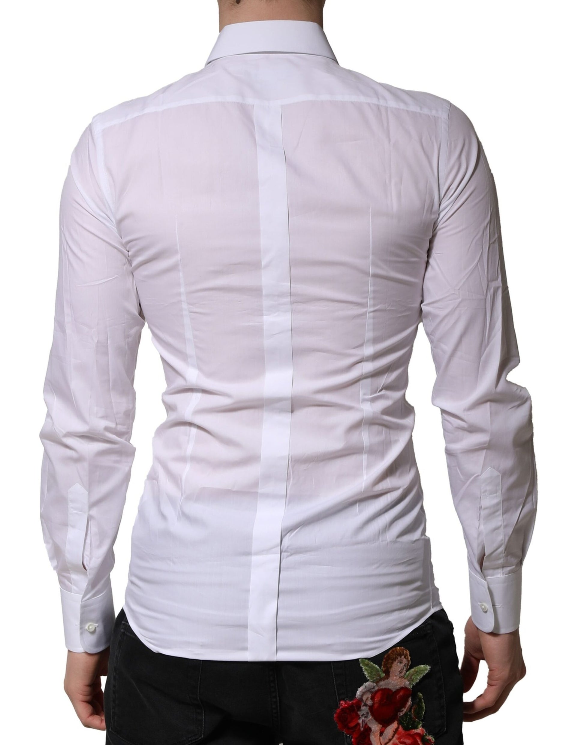 A white dress shirt with gold embellishments and a rose on the lapel