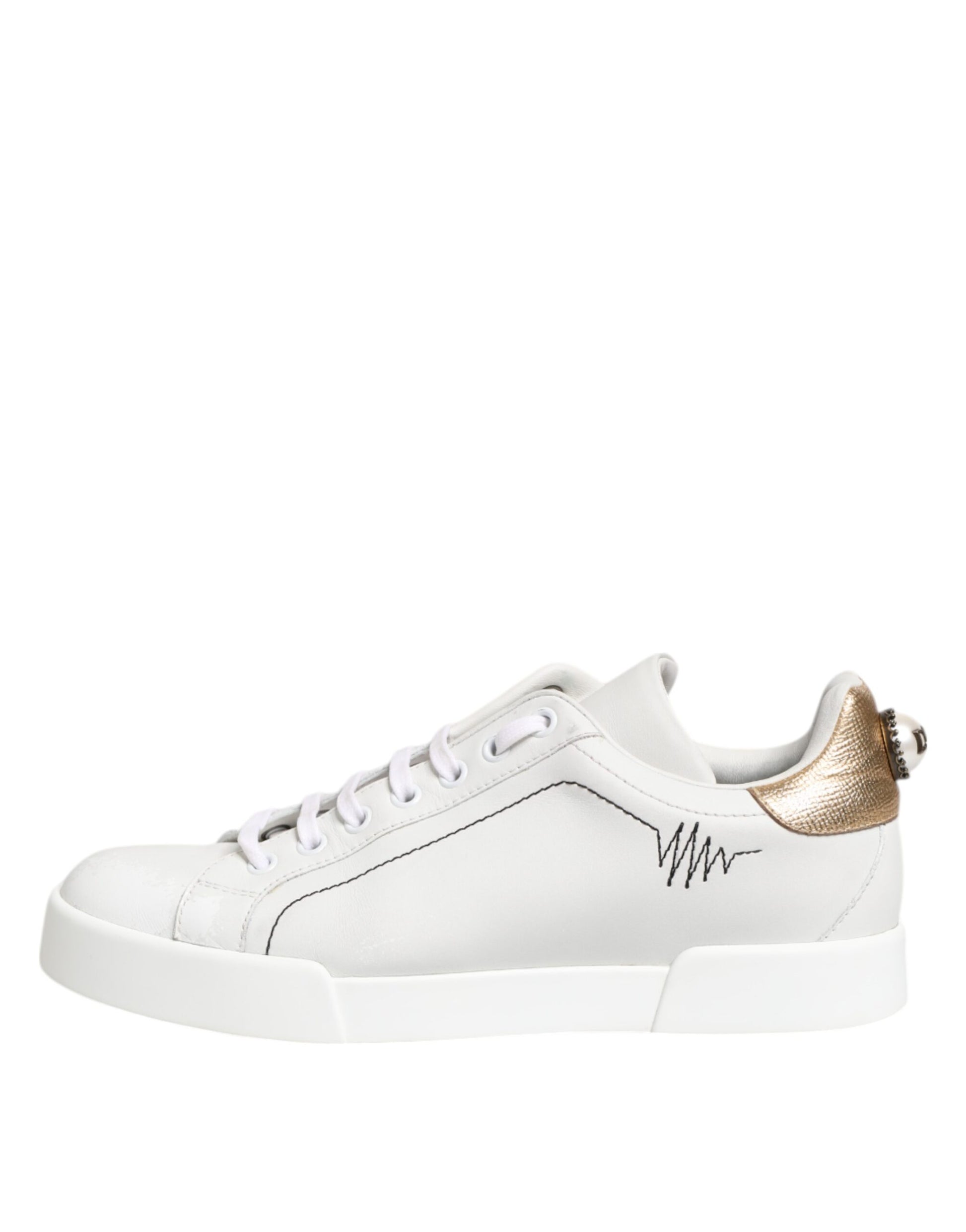 White gold leather low top sneakers with laces and a logo on the side