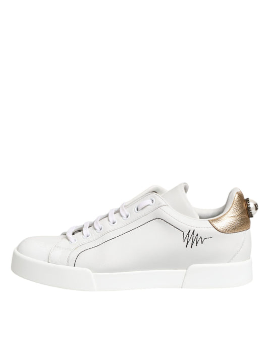 White gold leather low top sneakers with laces and a logo on the side