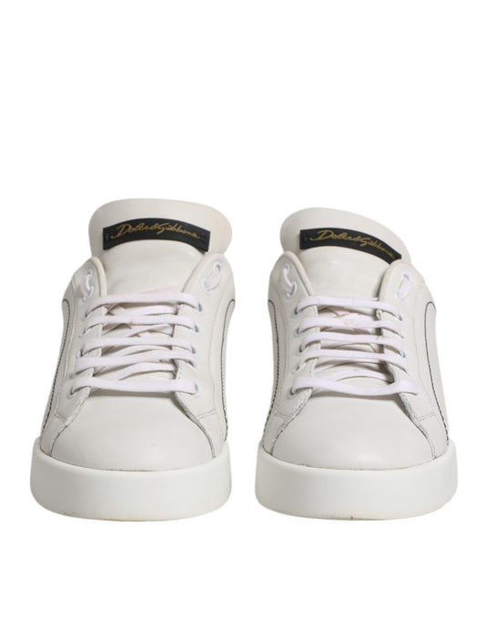 Pair of white sneakers with pink laces