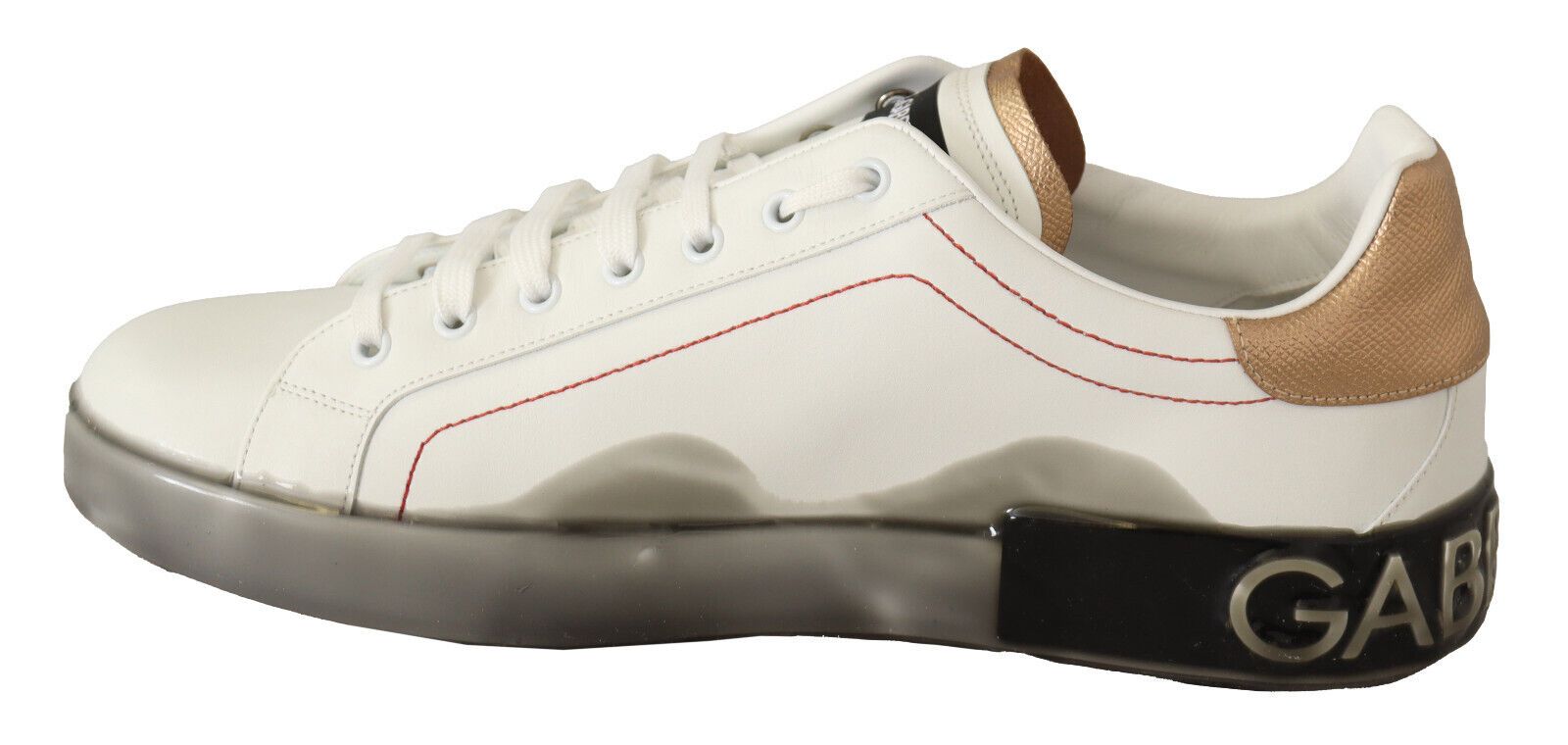White sneaker with gold accents and red detailing