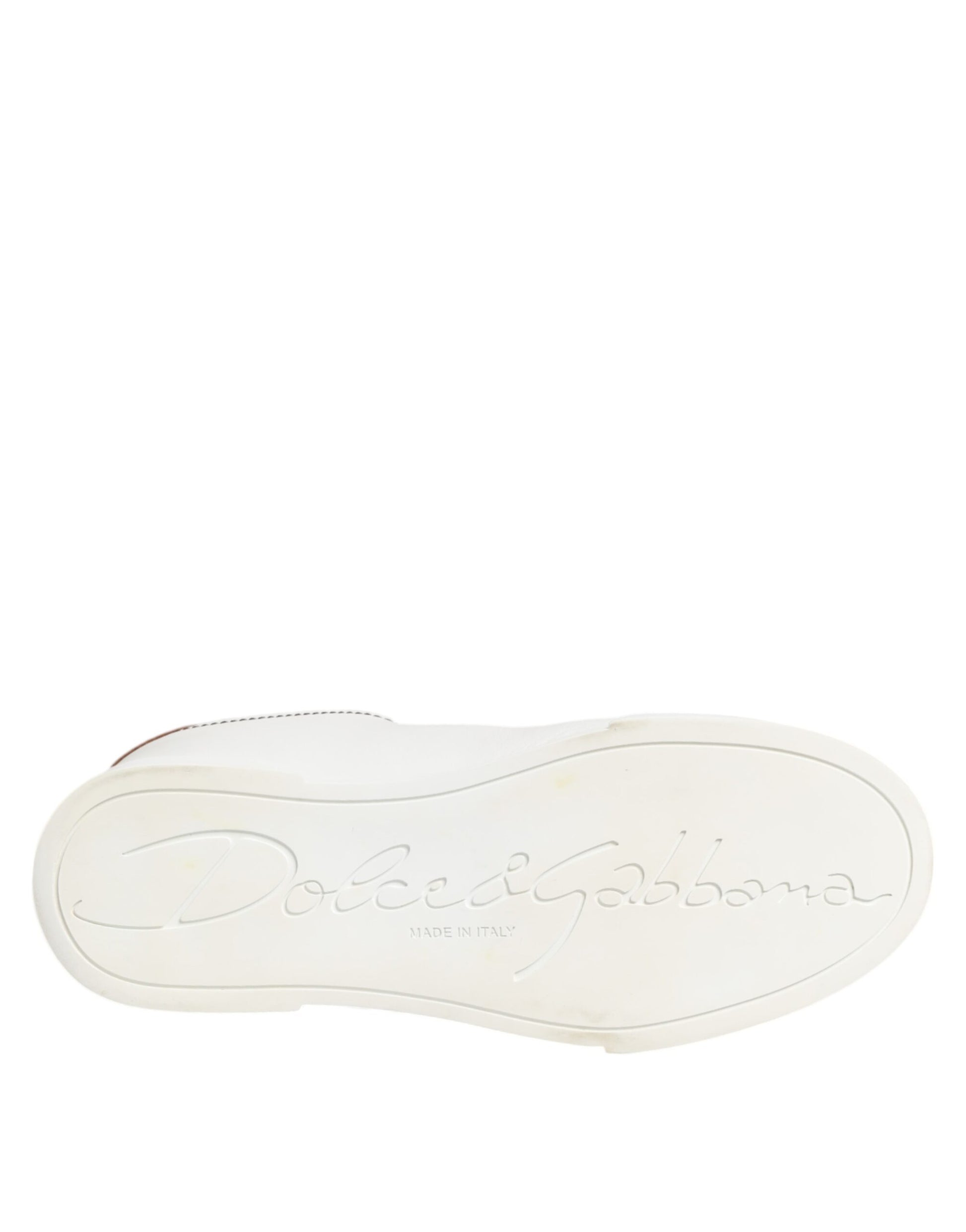 A pair of white gold leather sneakers with a low top, featuring the Dolce & Gabbana logo