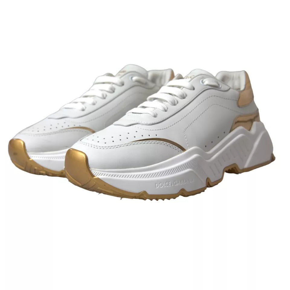 White gold leather men's sneakers with black laces and a logo on the side