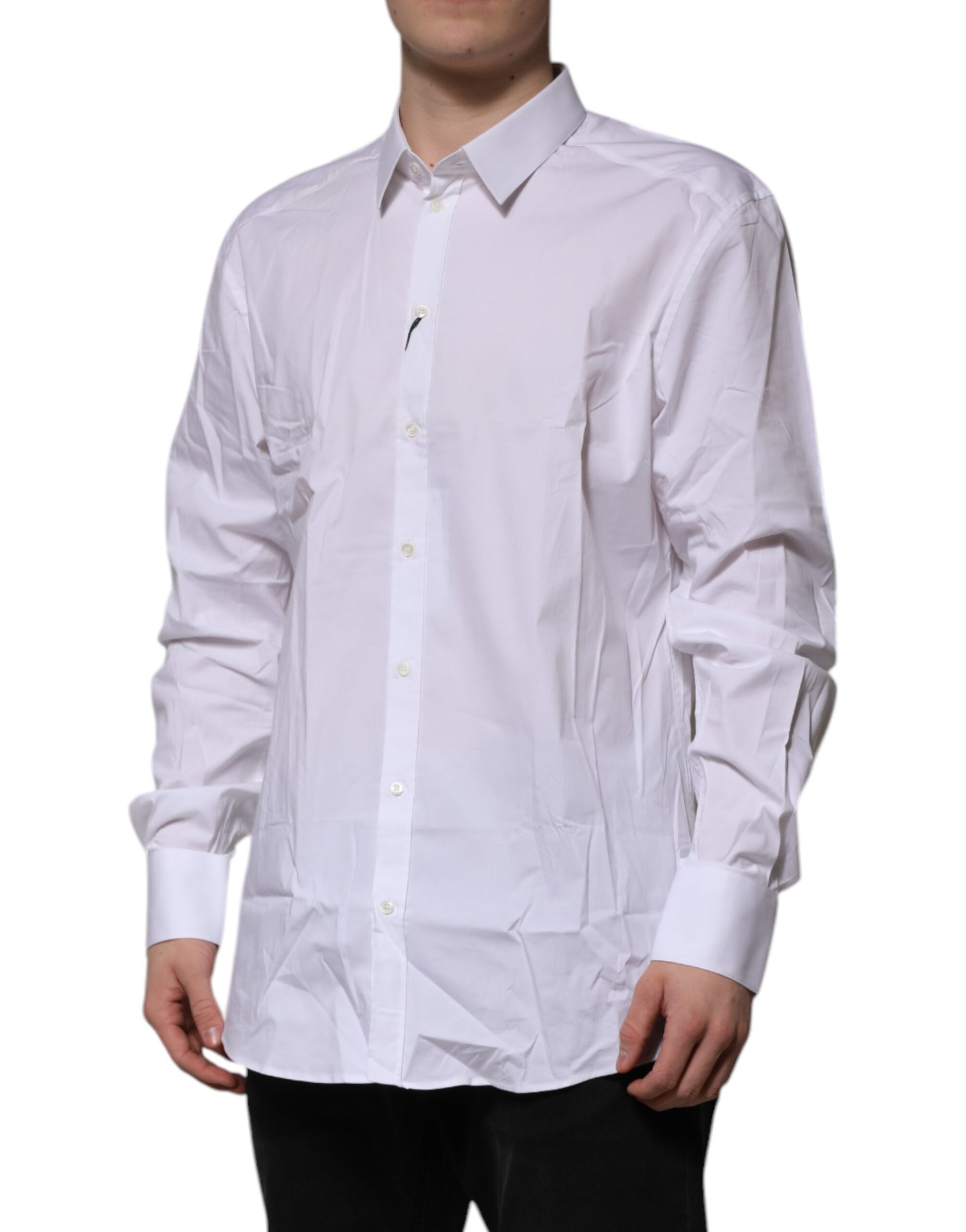 A long sleeved white dress shirt with a gold pattern, designed by Dolce & Gabbana