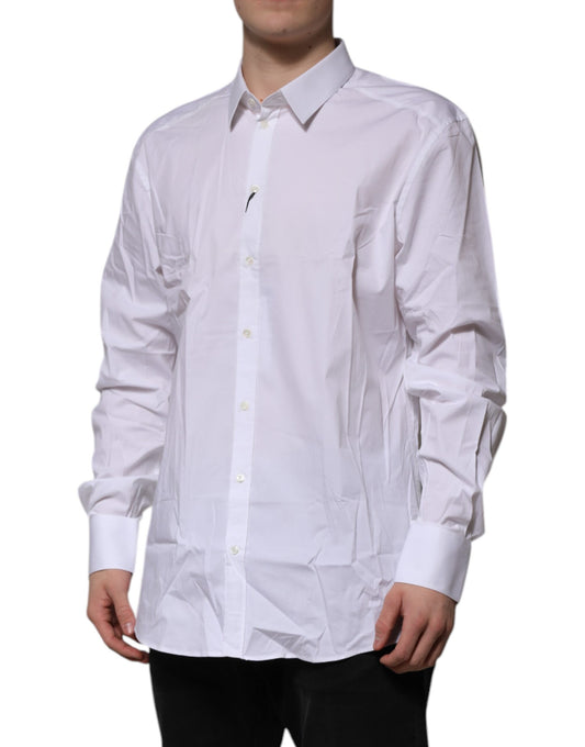 A long sleeved white dress shirt with a gold pattern, designed by Dolce & Gabbana