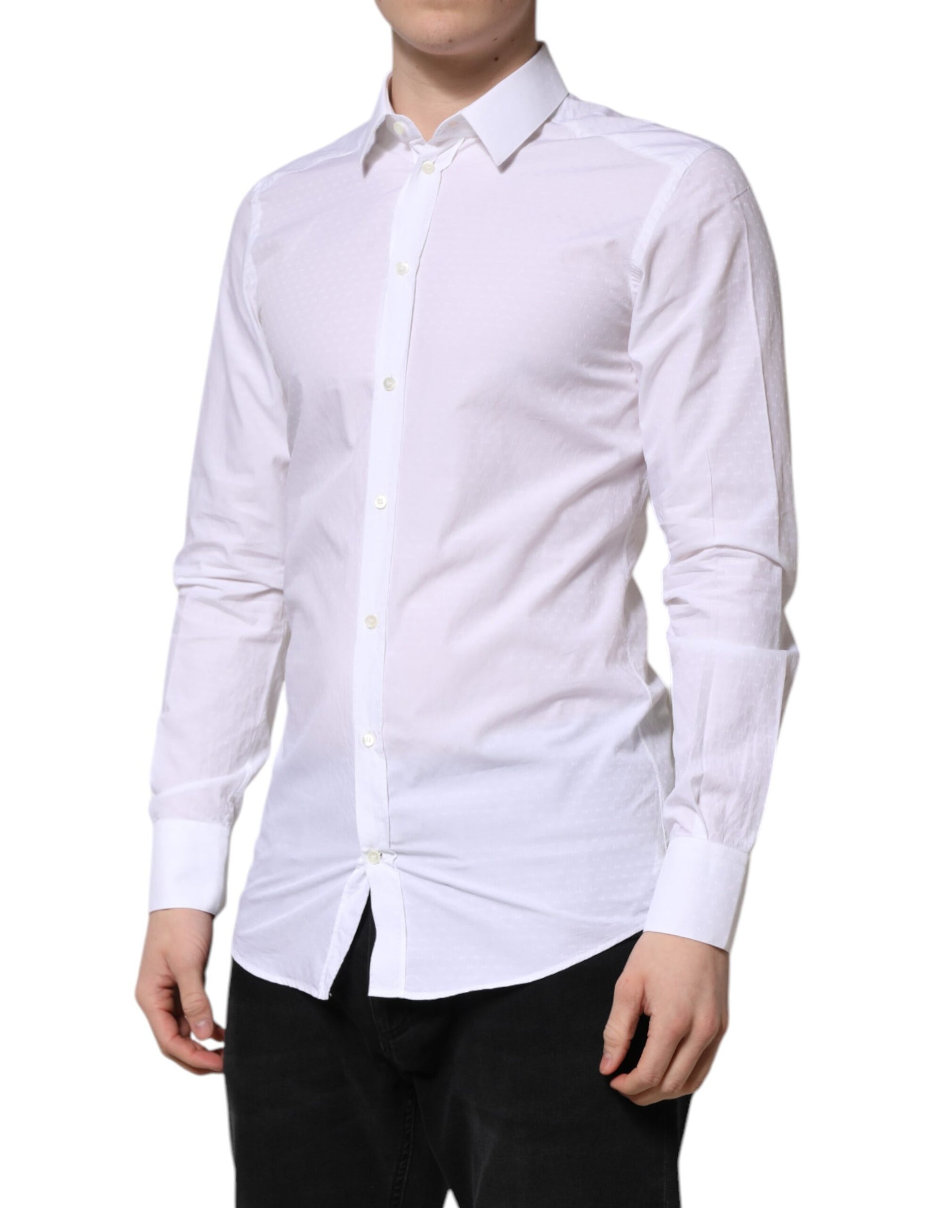 A mannequin wearing a white long sleeve shirt with gold accents