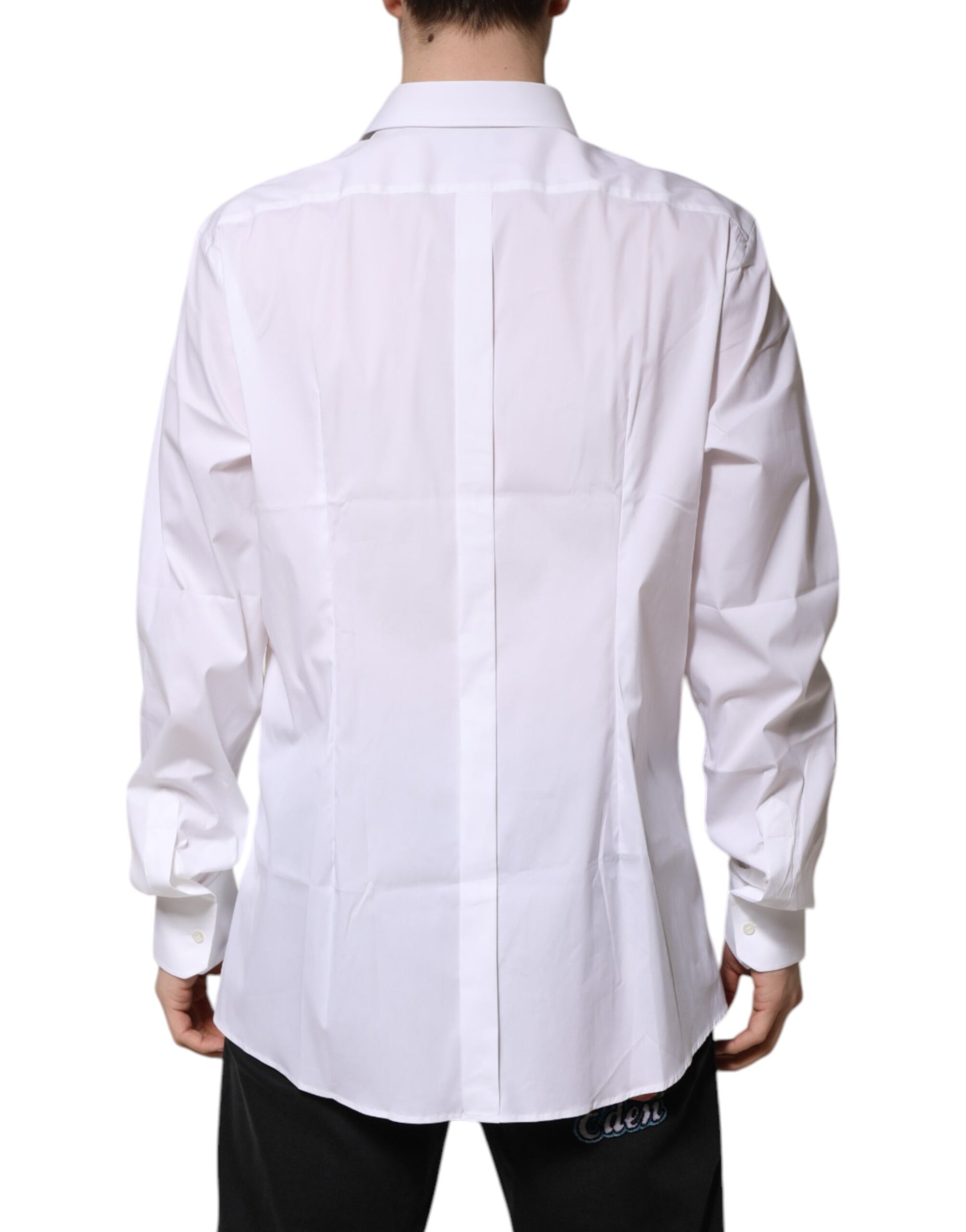 A long sleeve white dress shirt with gold accents, designed for men's formal wear