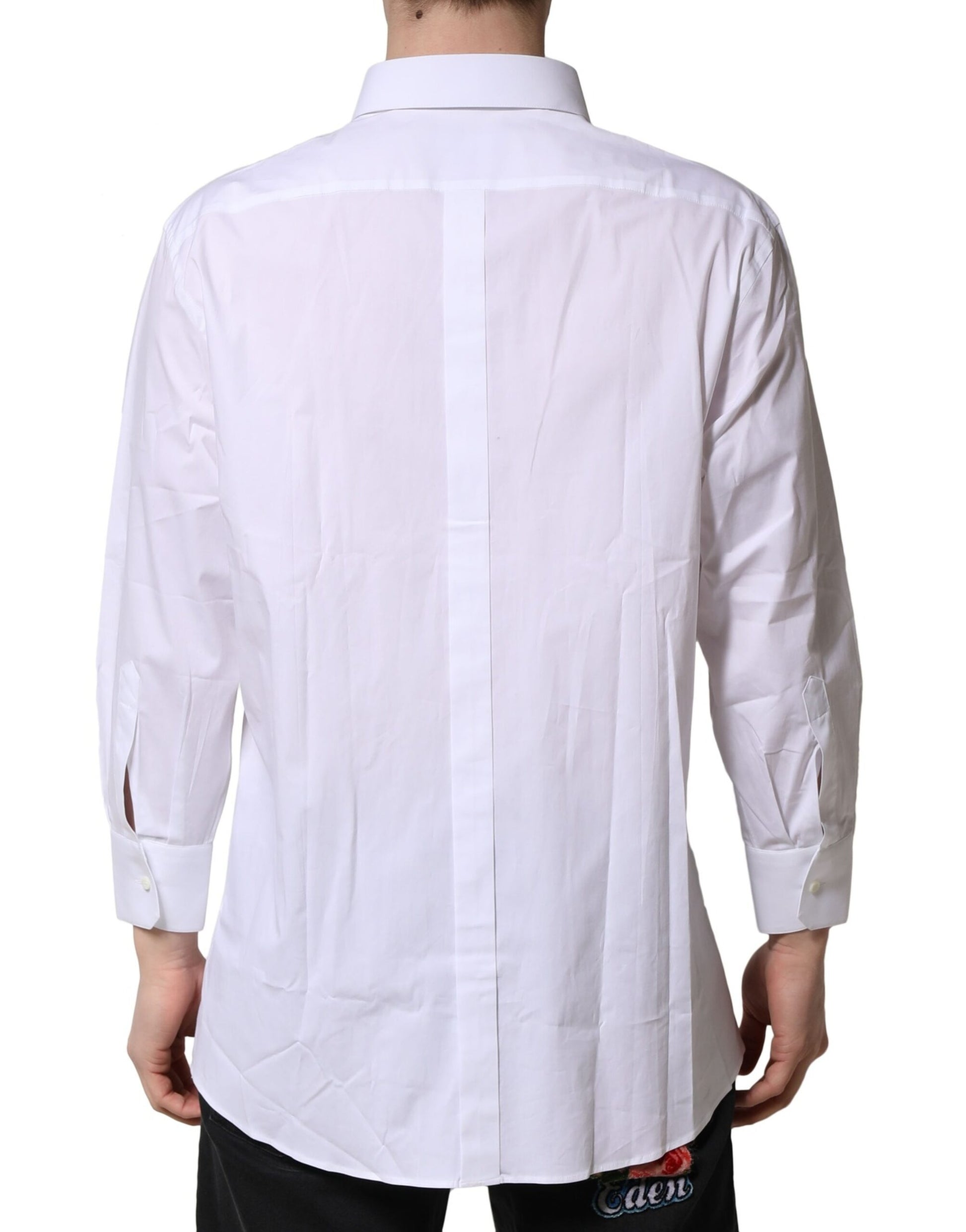 A long sleeved white dress shirt with a gold patterned back panel