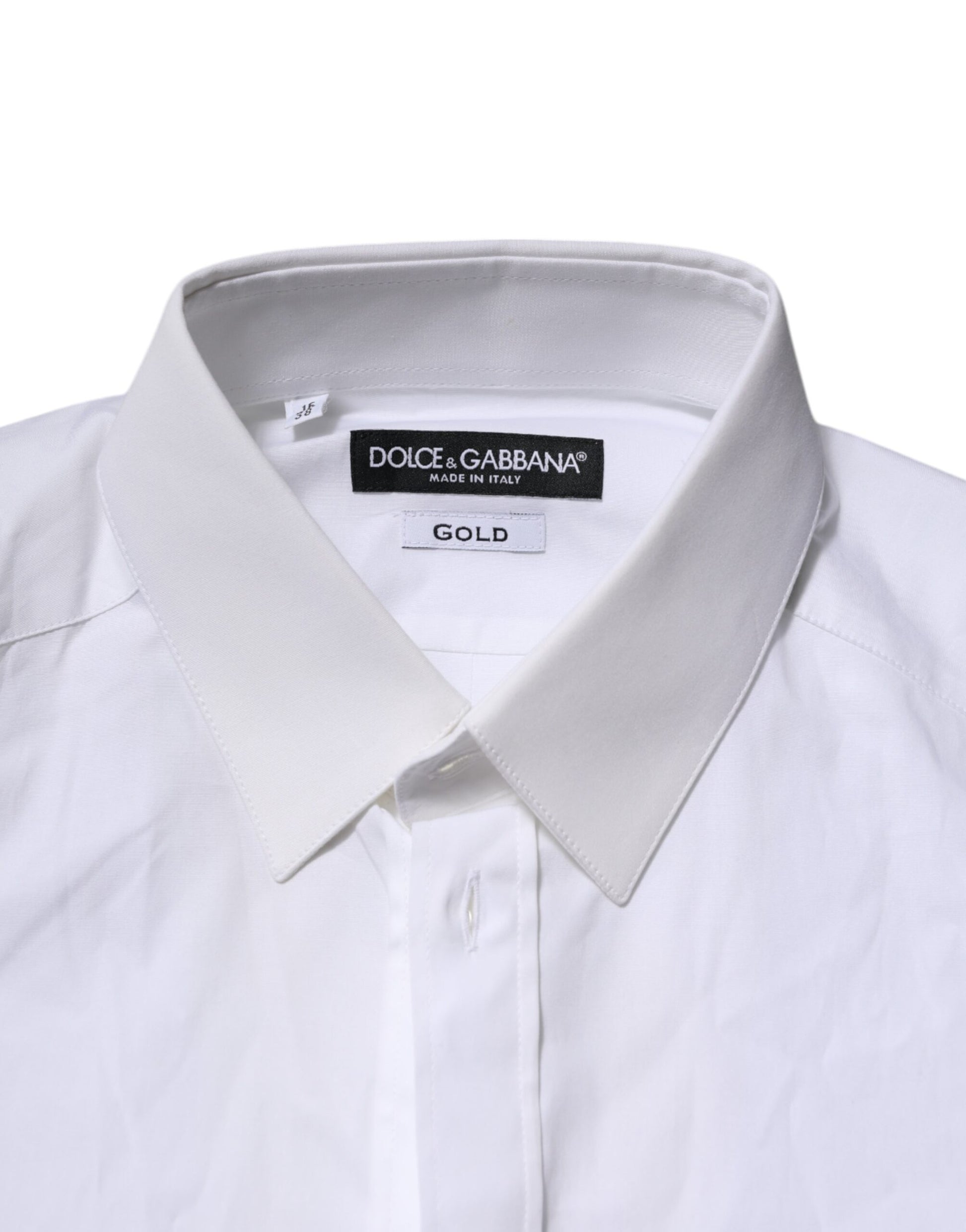 A white long sleeve shirt with a gold label from Dolce & Gabbana