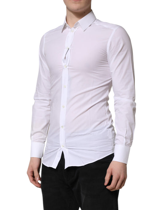 A mannequin wearing a white long sleeve dress shirt with gold accents