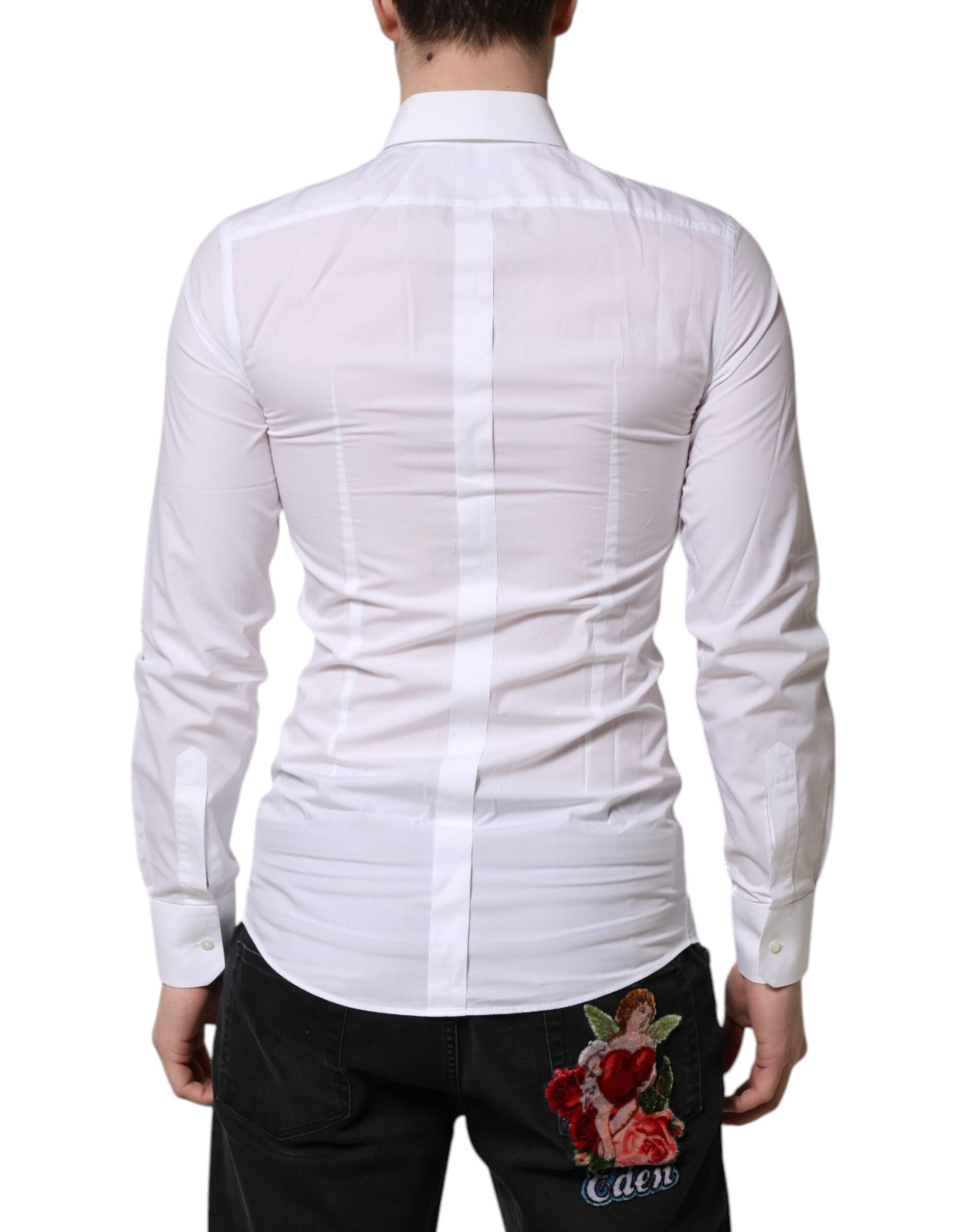 A long sleeve formal shirt with a gold design on the back, worn by a mannequin