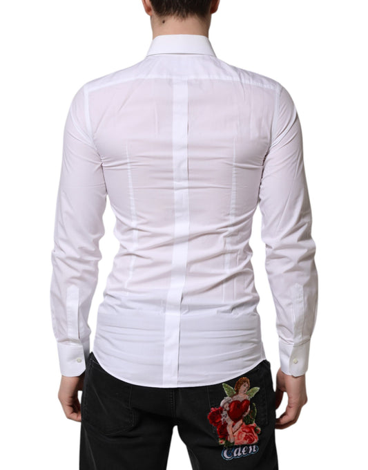 A long sleeve formal shirt with a gold design on the back, worn by a mannequin