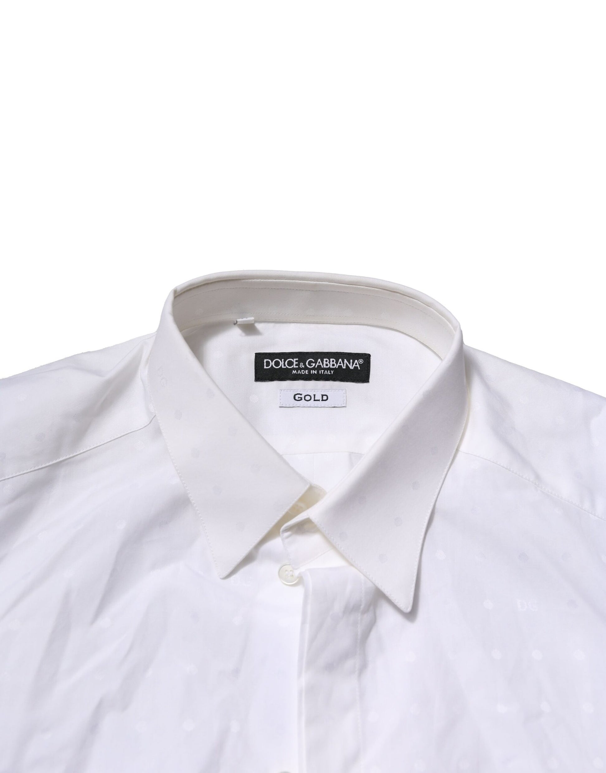A white long sleeve dress shirt with a gold label on the collar