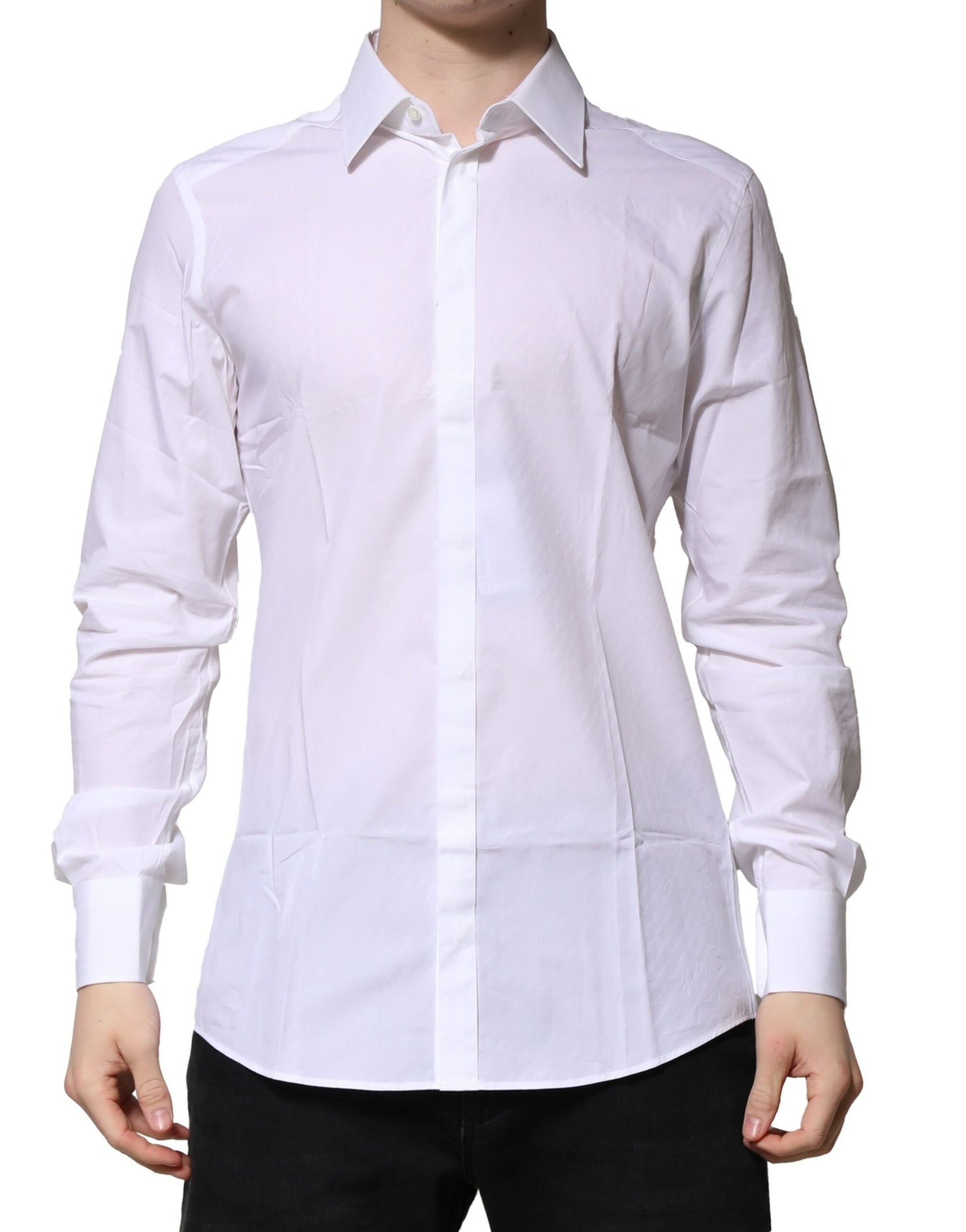 A long sleeve men's dress shirt in white with gold accents