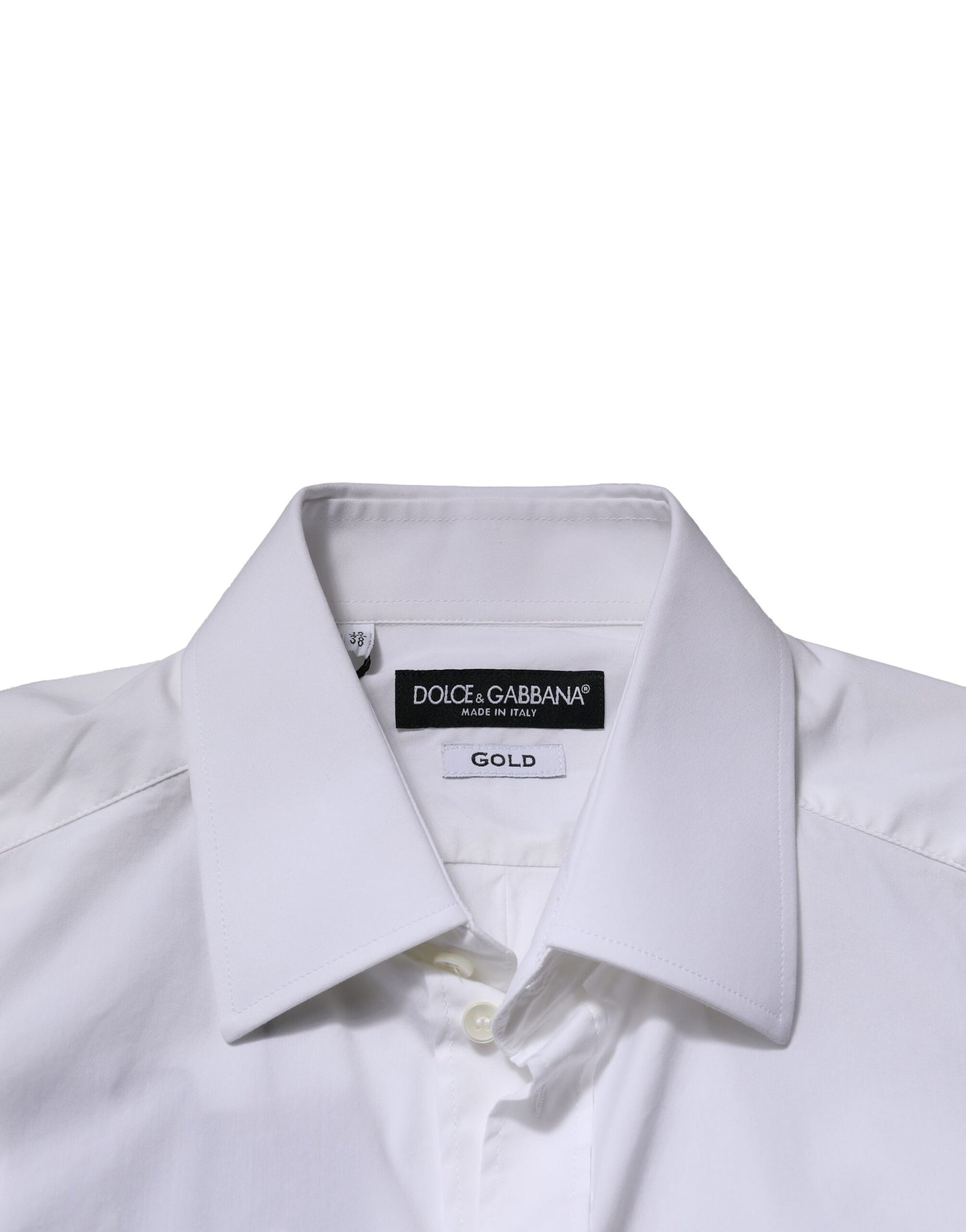 A white long sleeve shirt with a gold label from Dolce & Gabbana