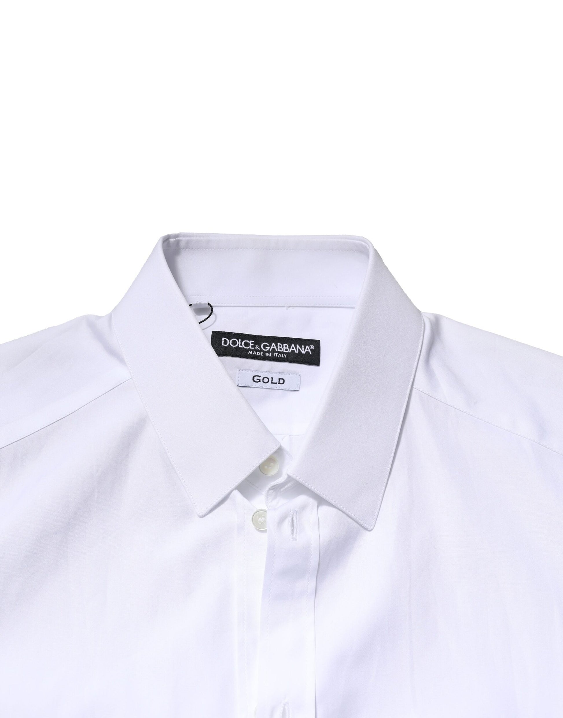 A white long sleeve dress shirt with a collar and gold accents