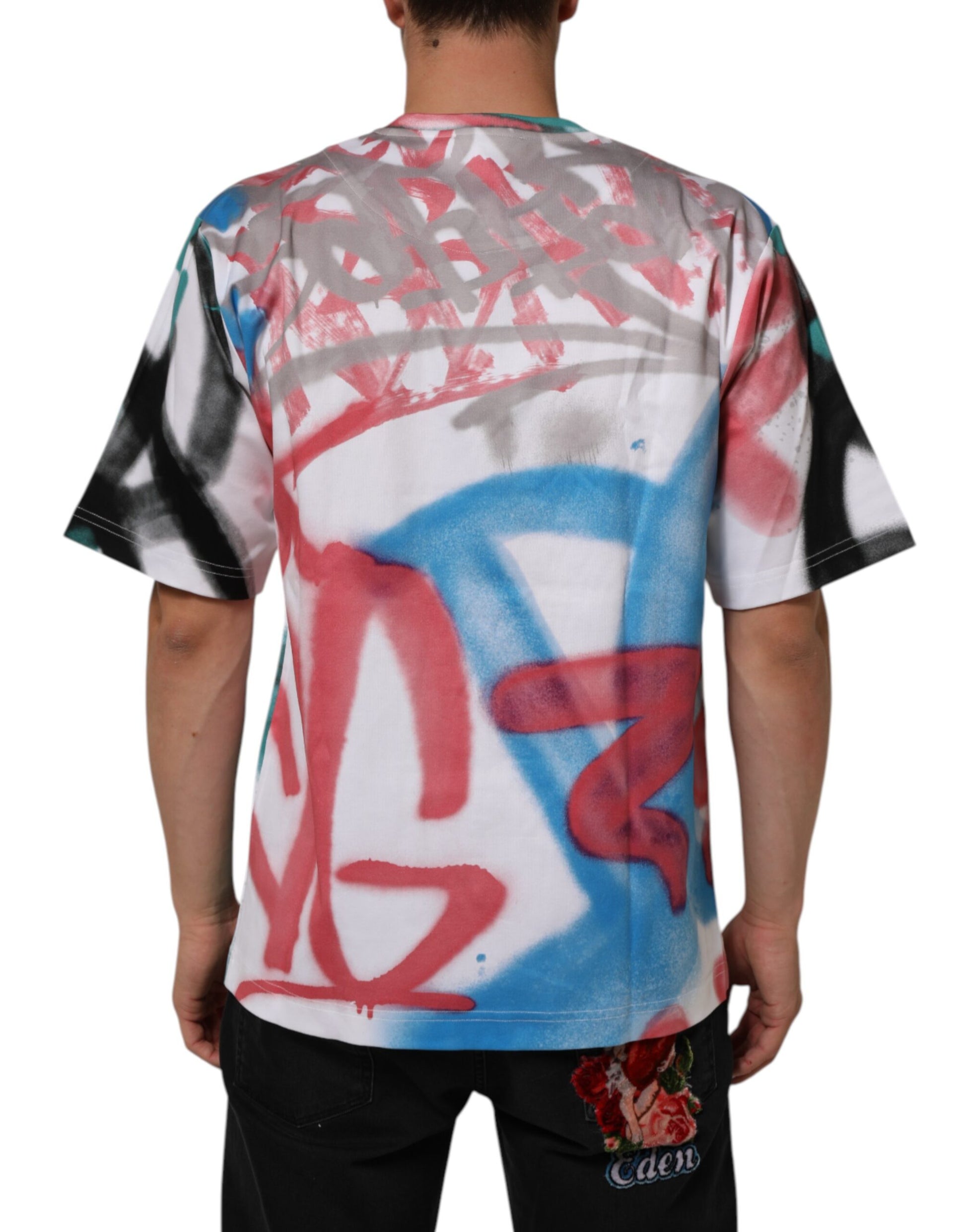 Back of a person wearing a shirt covered in graffiti style artwork