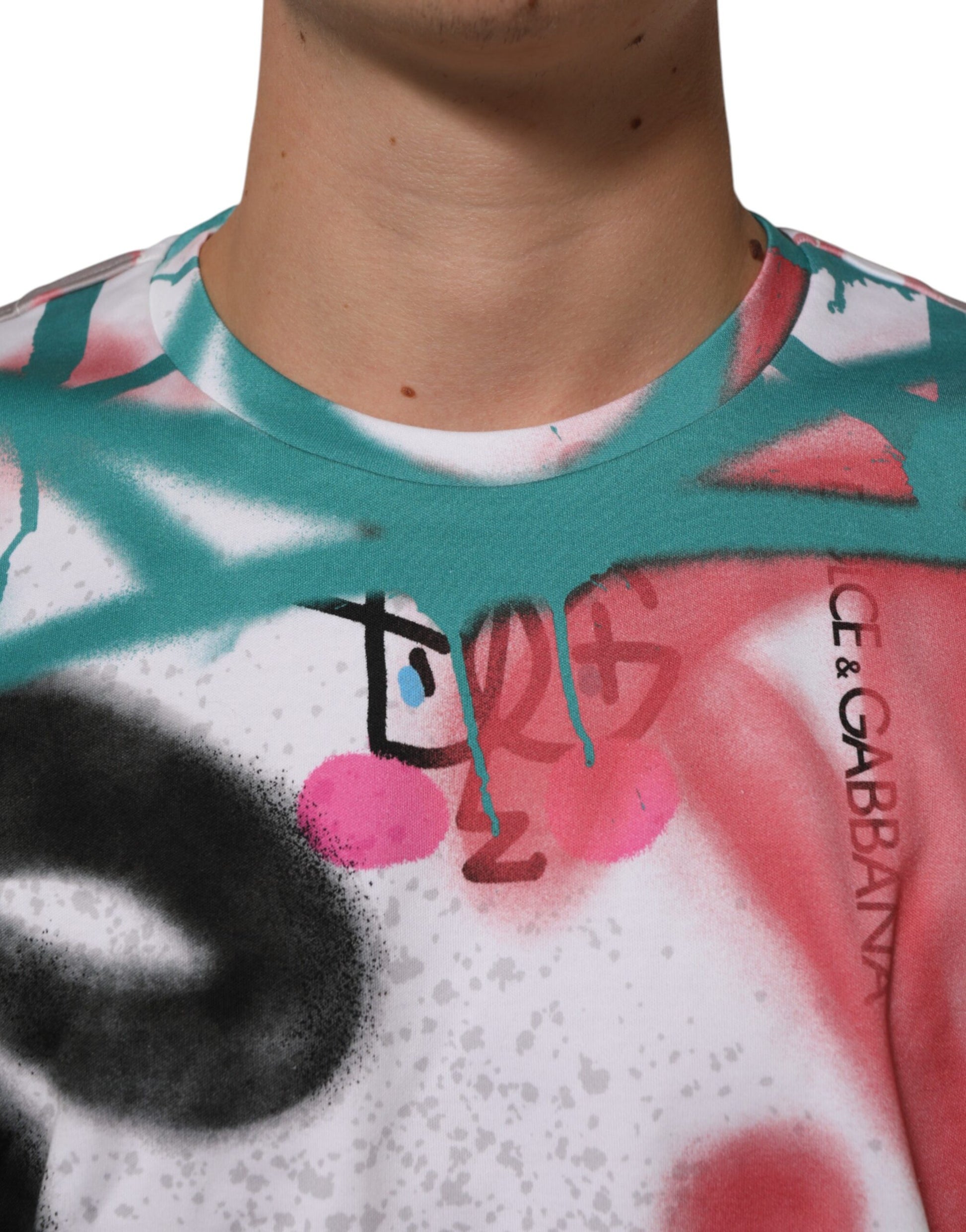 Man wearing a tie-dye shirt with graffiti style artwork