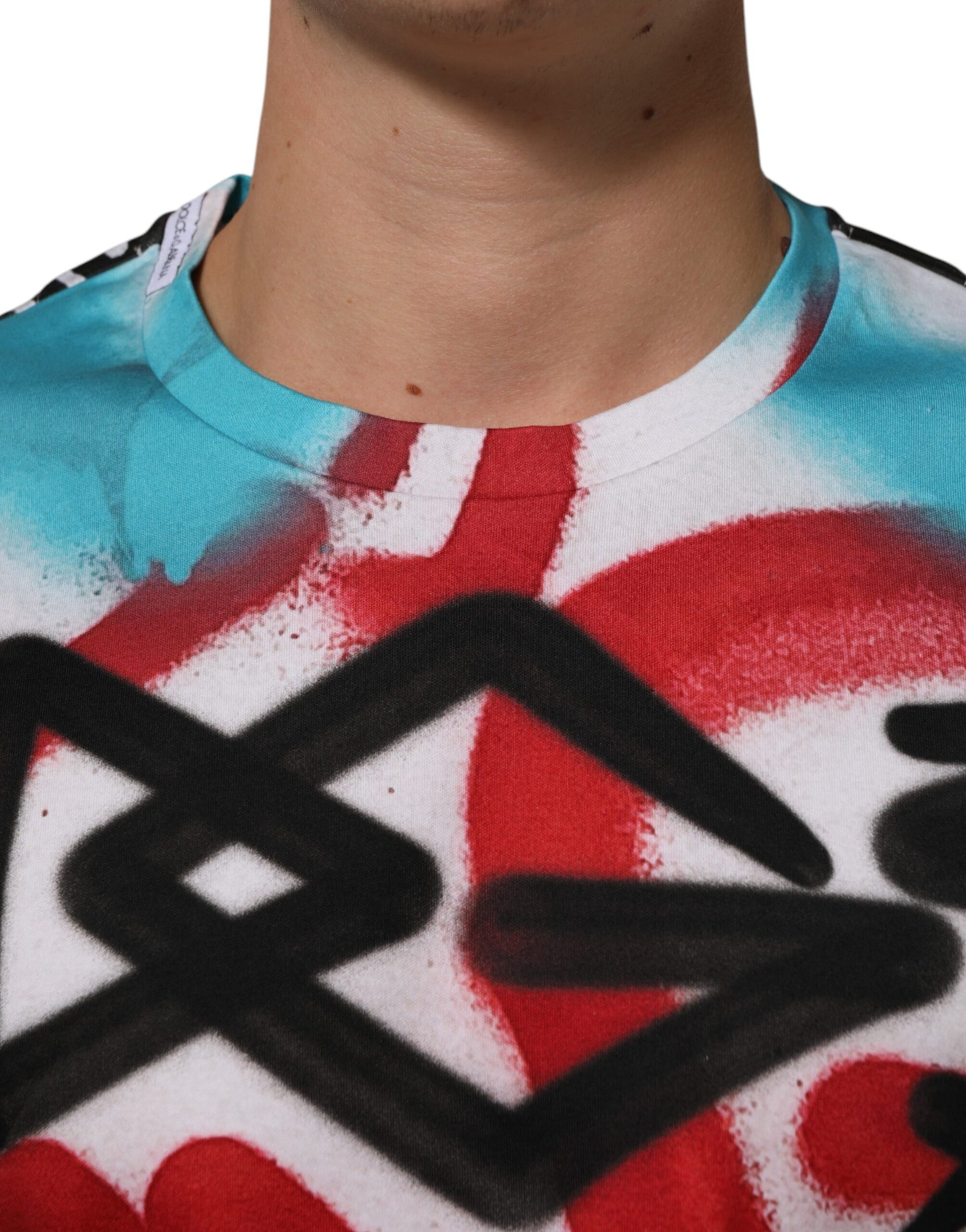 Man wearing tie dye shirt with graffiti design