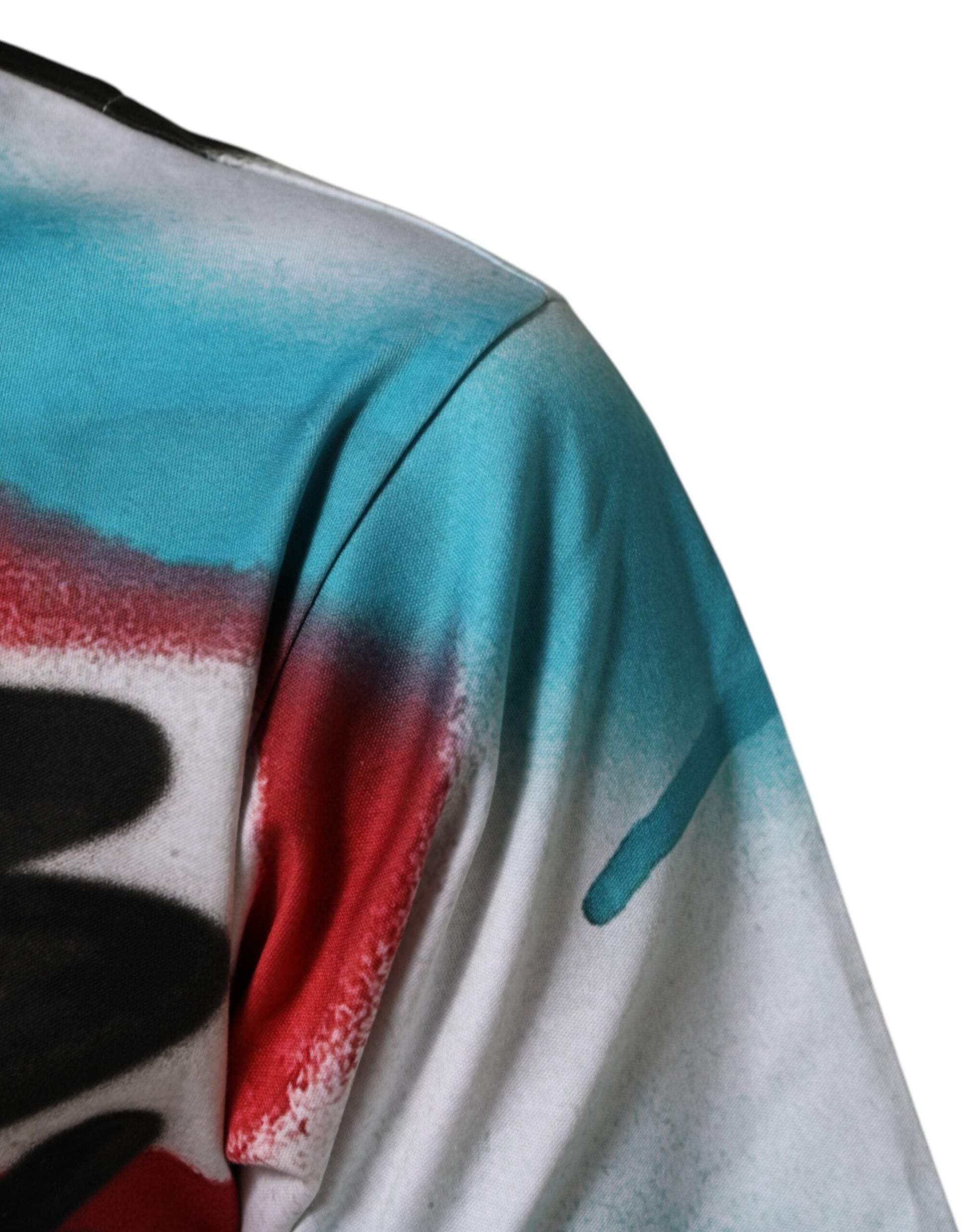 The shirt is tie dye with red, blue, and white colors