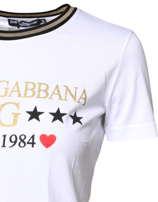 White t-shirt with gold lettering and stars