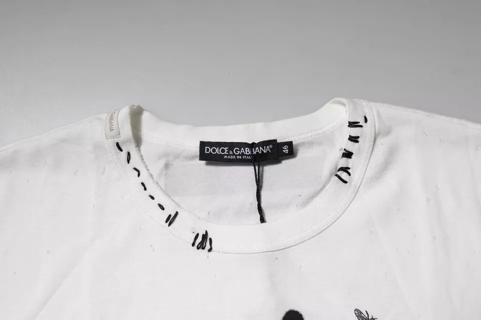 White t-shirt on hanger with black writing