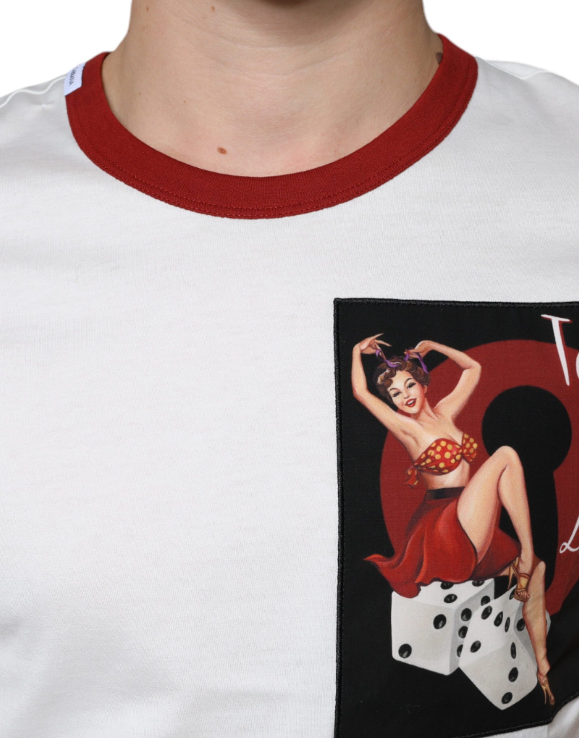 White t-shirt with red collar featuring a patch of a woman in a red dress dancing on a poker chip