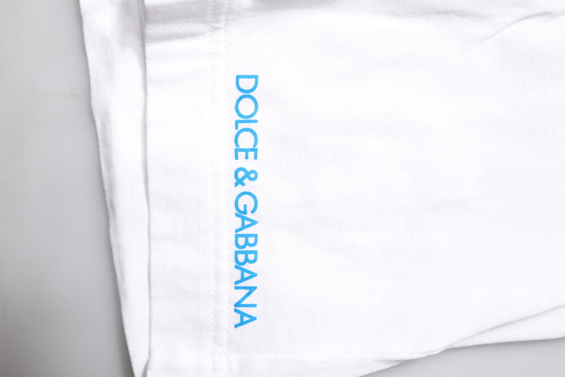 White towel with blue writing