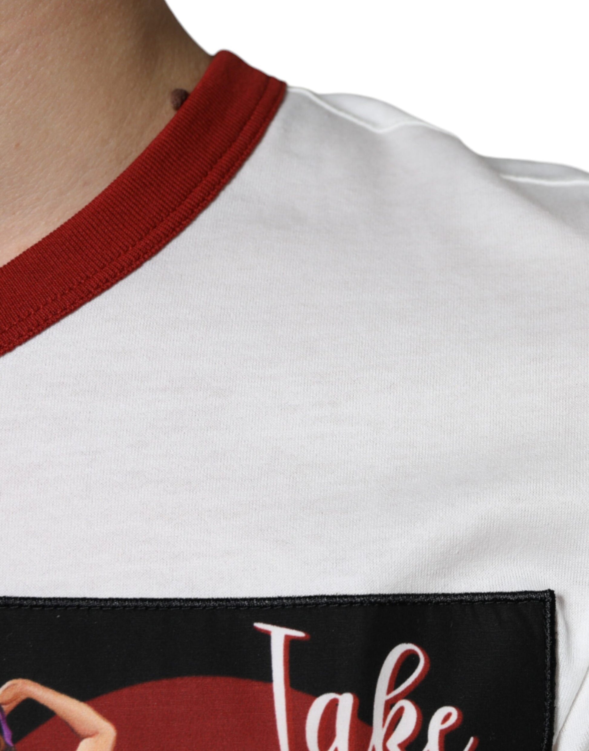 White t-shirt with red sleeves and a pocket on front featuring a graphic design of a person in a pose