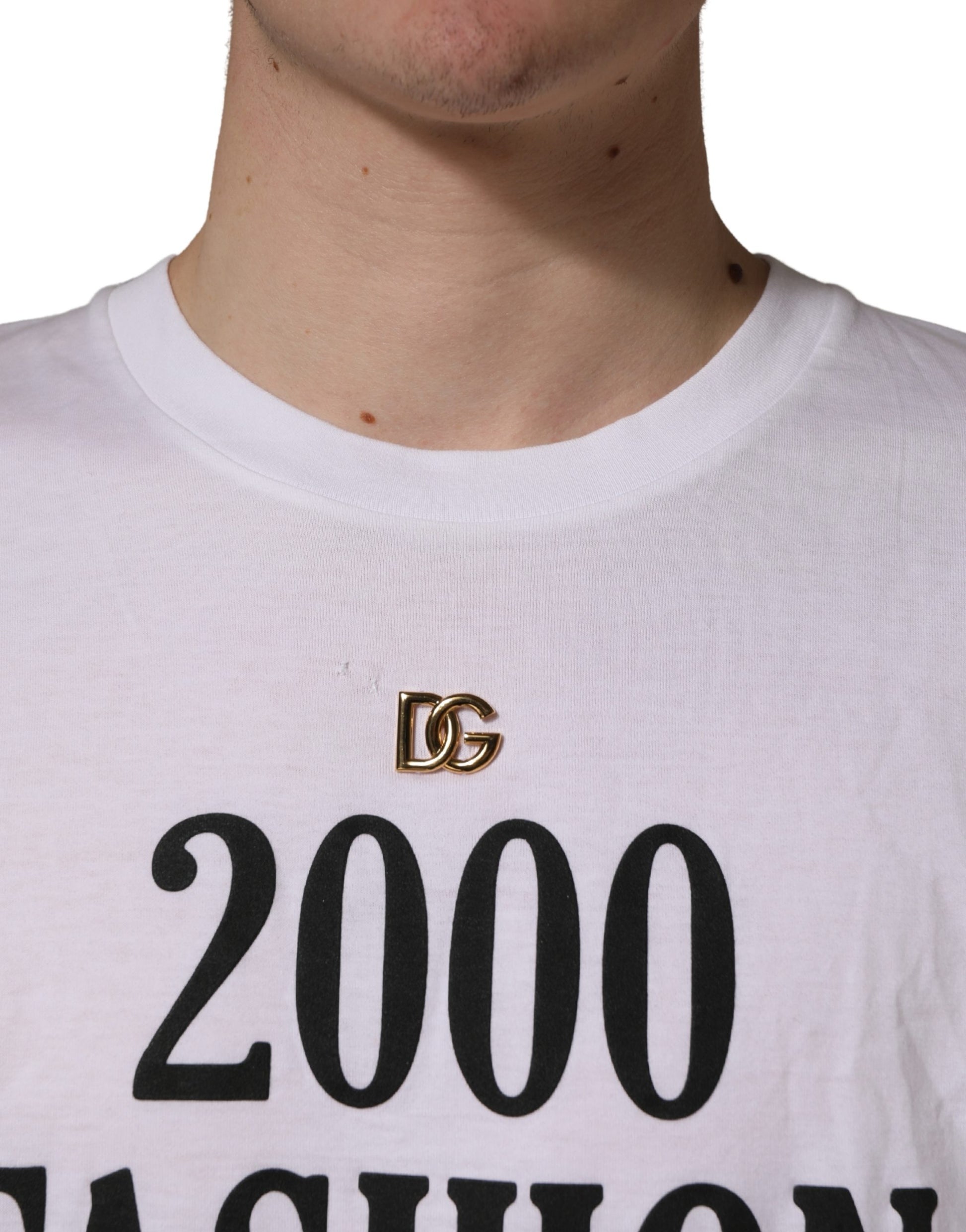 White t-shirt with black lettering and a gold D&G logo on the chest