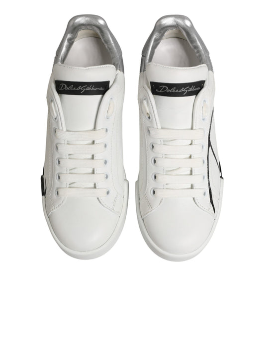 Pair of white sneakers with gray accents, featuring a low top and leather material