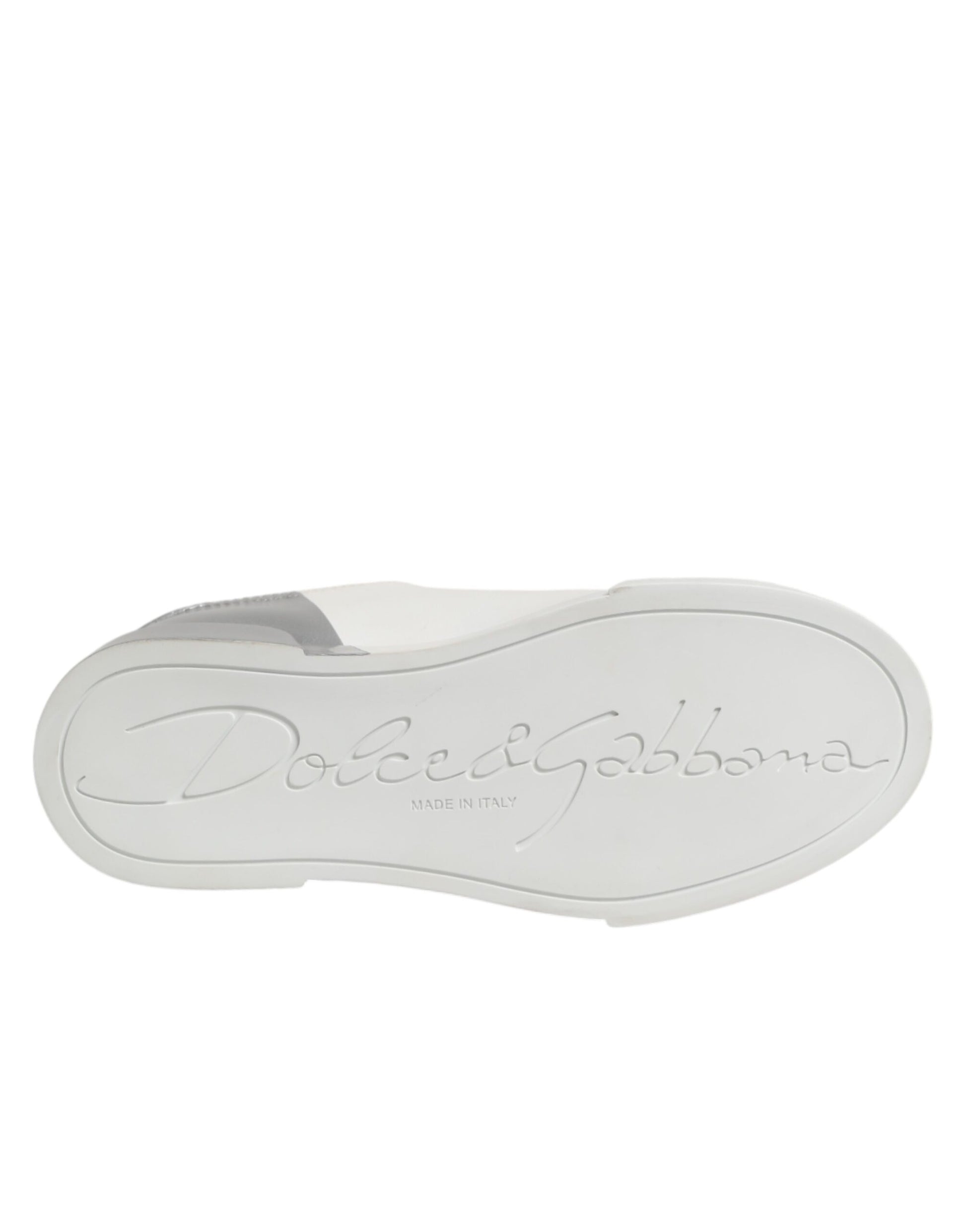 A white and gray low top leather sneaker with a logo on the side