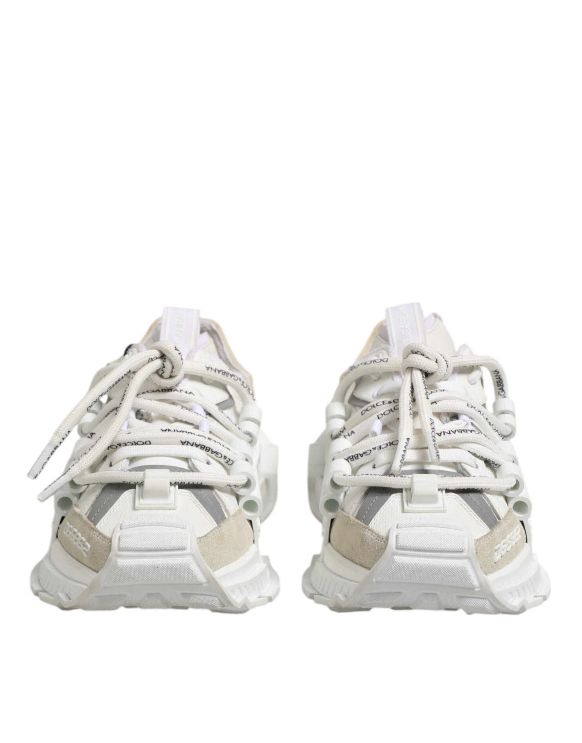 Pair of white sneakers with laces tied in a bow