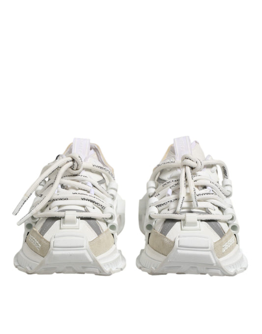 Pair of white sneakers with laces tied in a bow