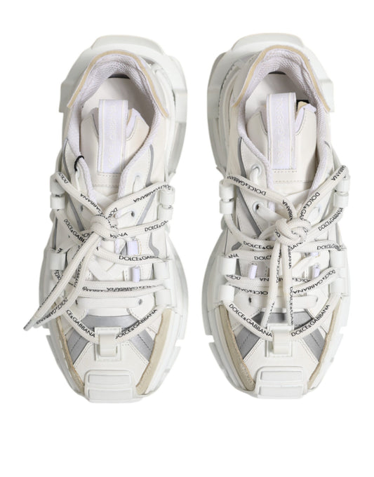 Pair of white sneakers with laces tied in a bow