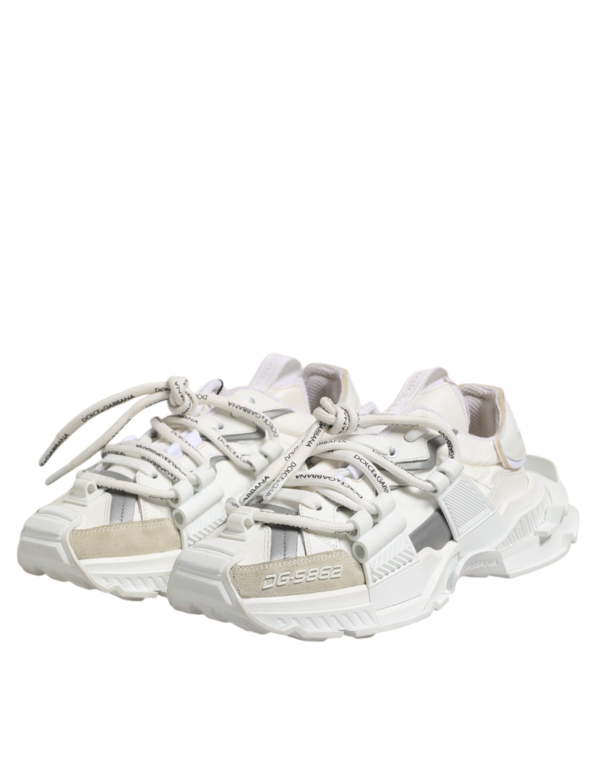 Pair of white sneakers with laces