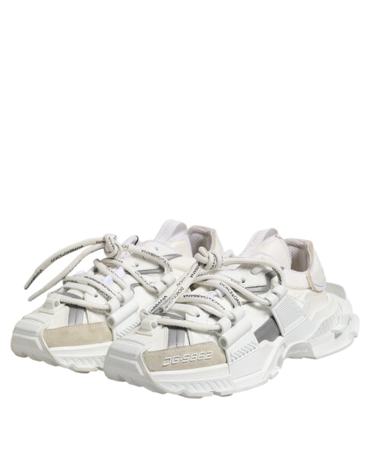 Pair of white sneakers with laces