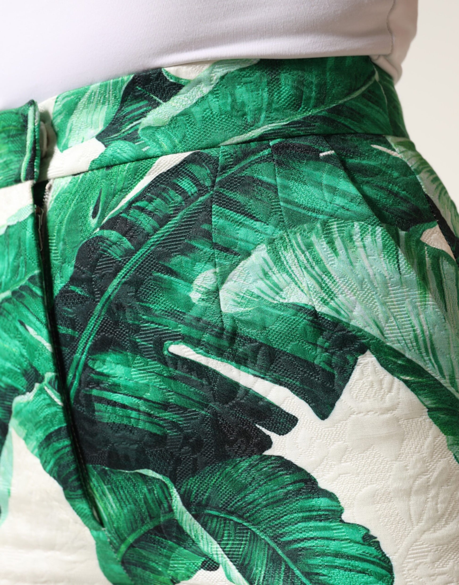 Green tropical leaf pattern on shorts