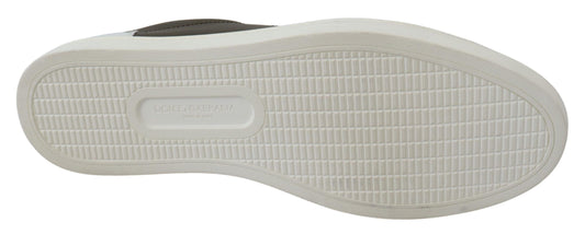 Pair of white sneakers with black soles