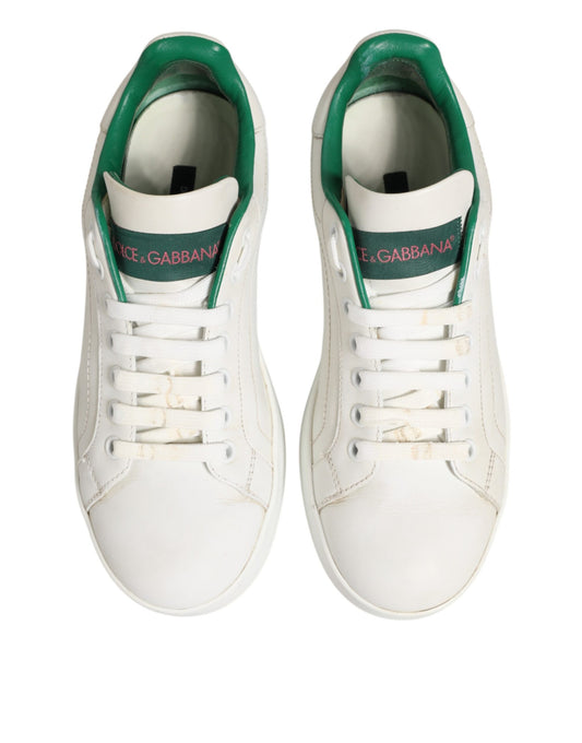 Pair of white sneakers with green accents