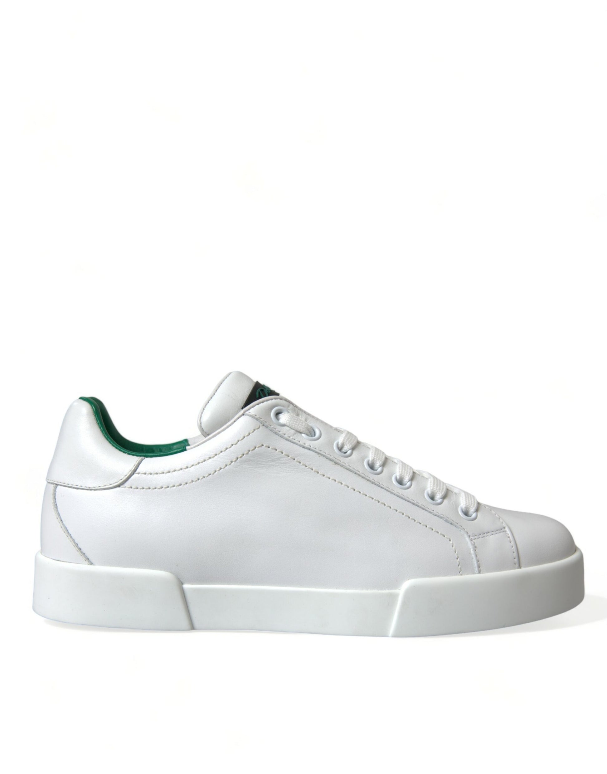White sneaker with green laces and sole