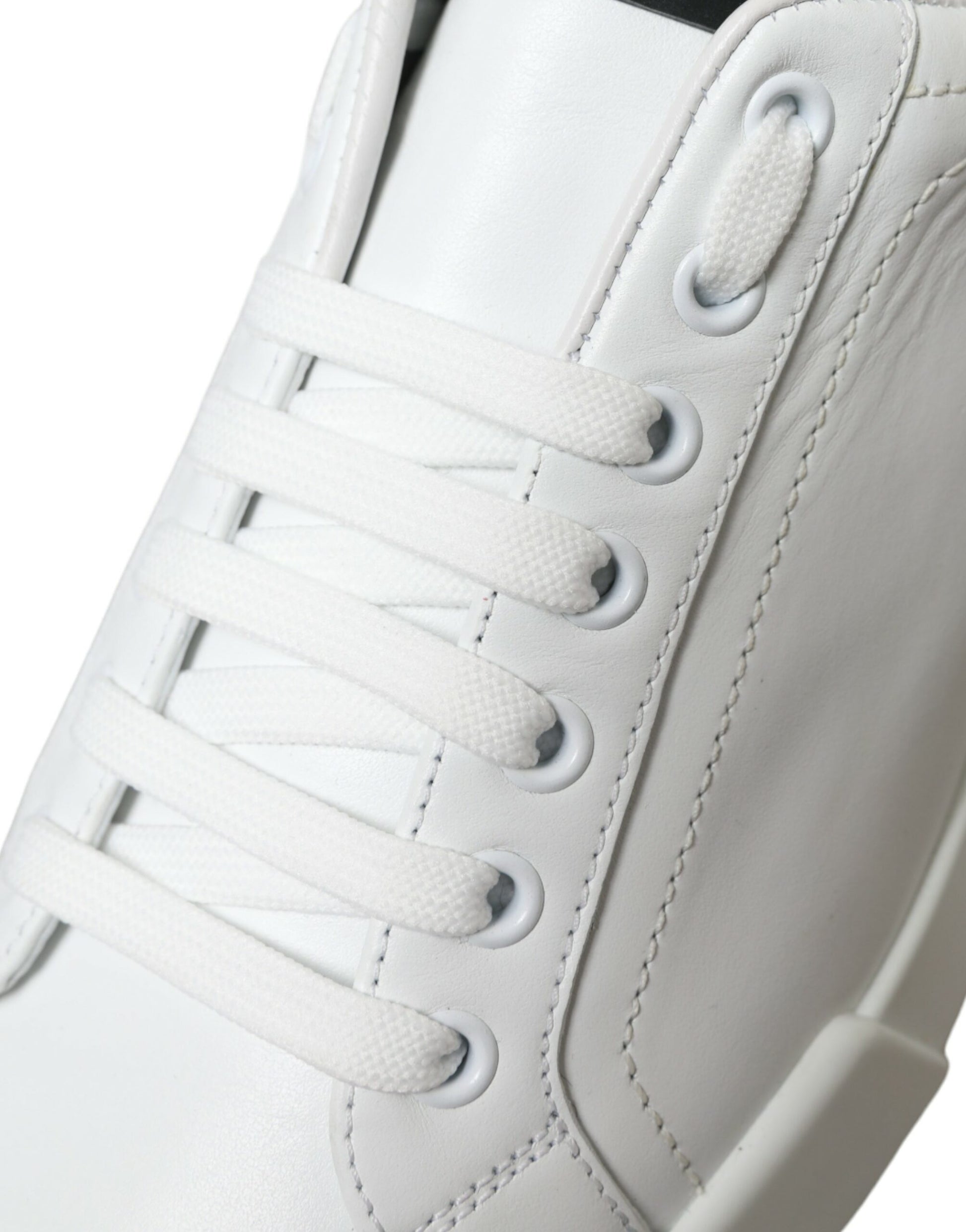 White sneaker with laces and a logo on the side