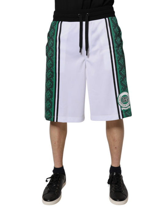 A pair of white and green men's jersey sweat shorts with a logo on the left leg. They are designed for athlet