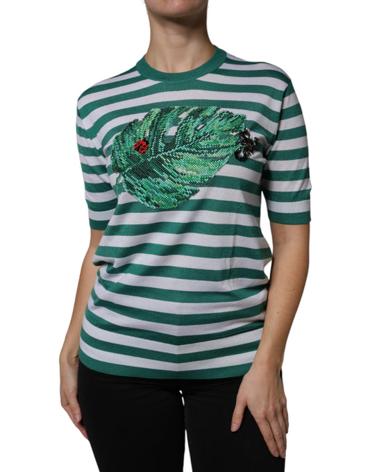Green and white striped sweater with a bird design on the front