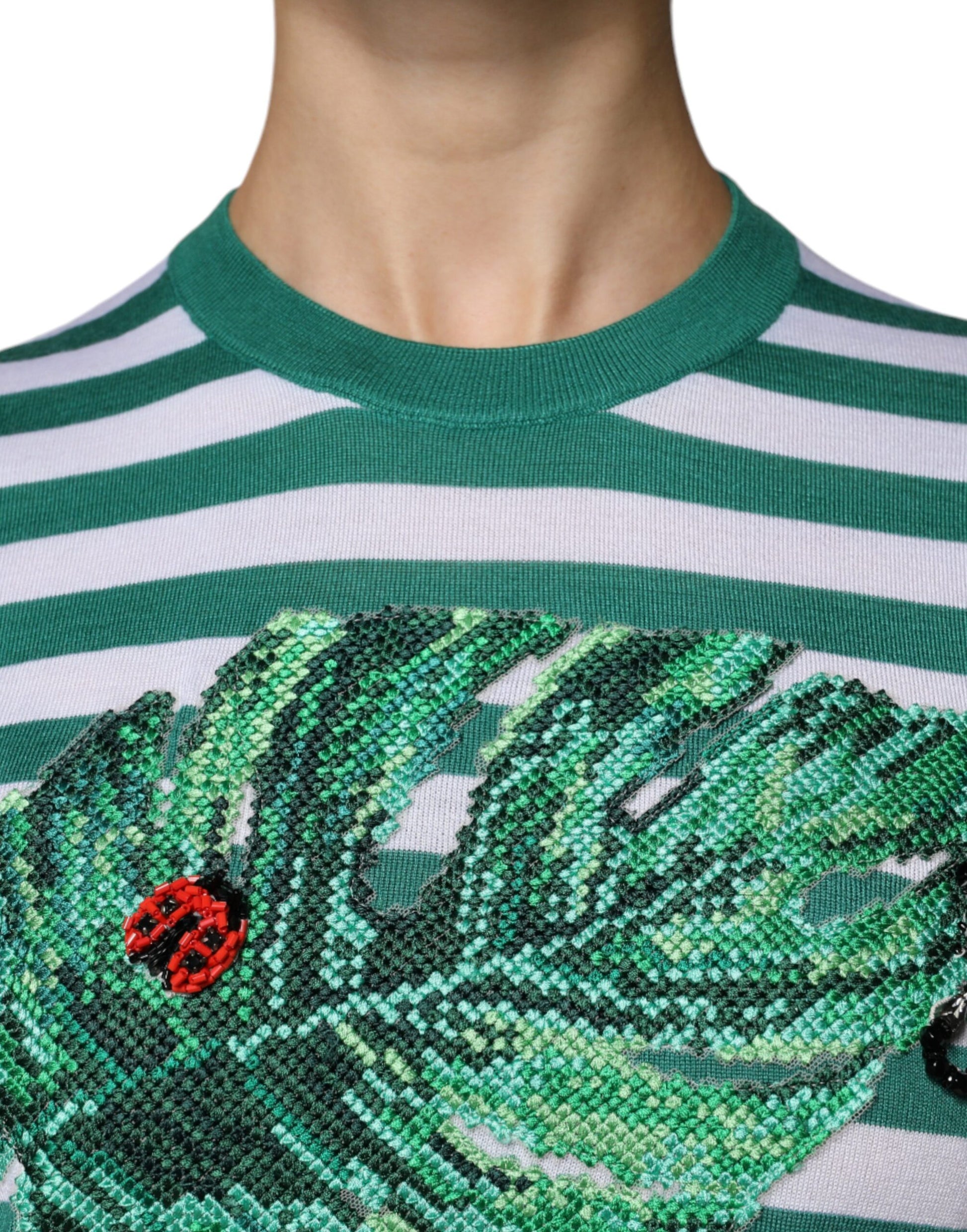 Green and white striped shirt with embroidered bird on front