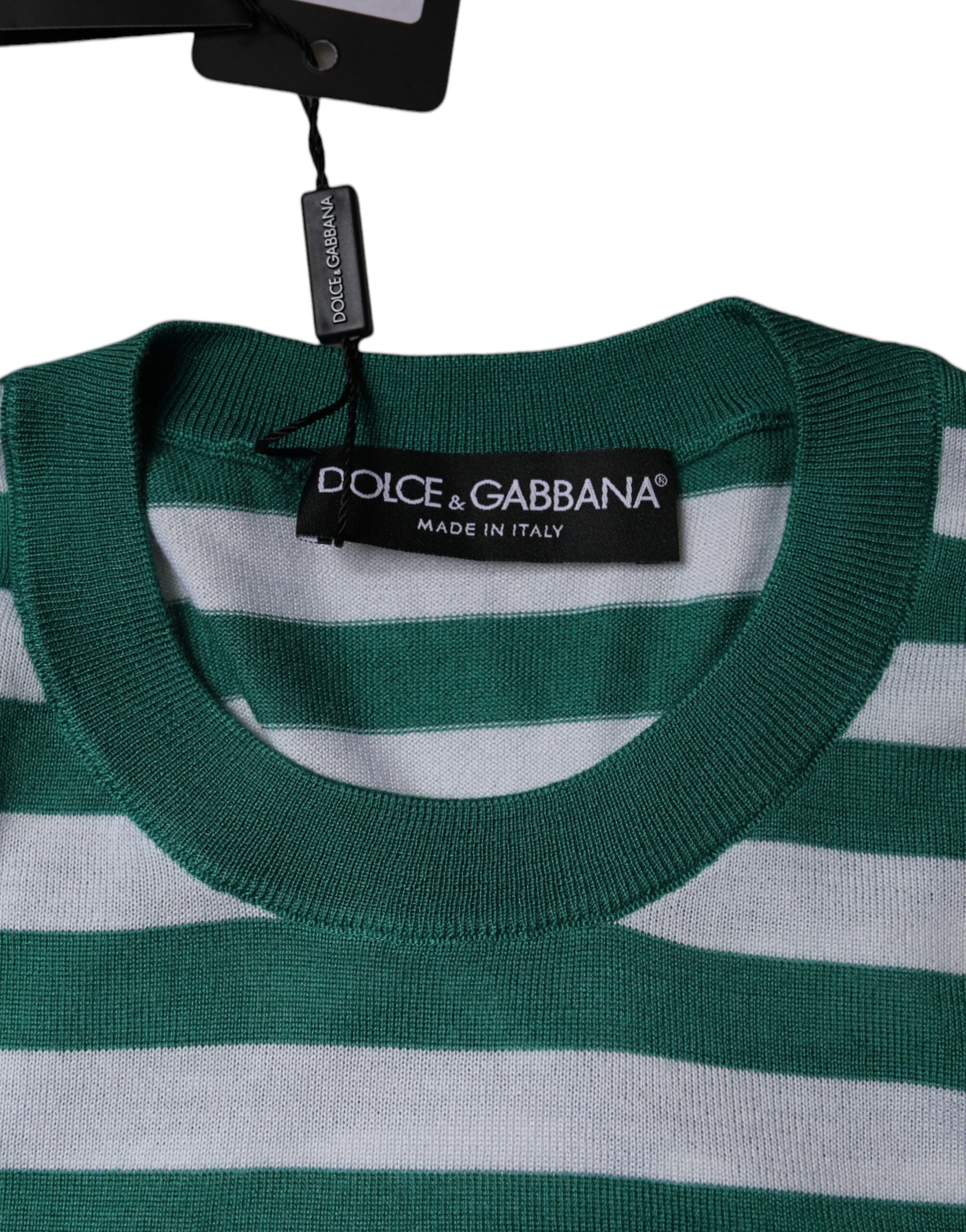Green and white striped sweater on hanger